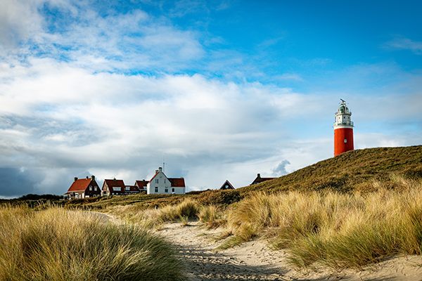 fotobehang van de vuurtoren op Texel - Airtexmania wandbekleding